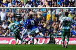 CARDIFF, WALES - APRIL 23:  QPR  player Adel Taarabt ( left) scores the second QPR goal during the npower Championship game between Cardiff City and Queens Park Rangers at Cardiff City Stadium on April 23, 2011 in Cardiff, Wales.  (Photo by Stu Forster/Getty Images)