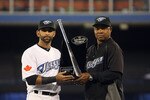 TORONTO,CANADA - APRIL 1:  Jose Bautista #19 of the Toronto Blue Jays is presented with the Silver Slugger award by hitting coach Dwayne Murphy #21 of the Toronto Blue Jays prior to facing the Minnesota Twins on opening day during their MLB game at the Rogers Centre April 1, 2011 in Toronto, Ontario, Canada.(Photo By Dave Sandford/Getty Images)