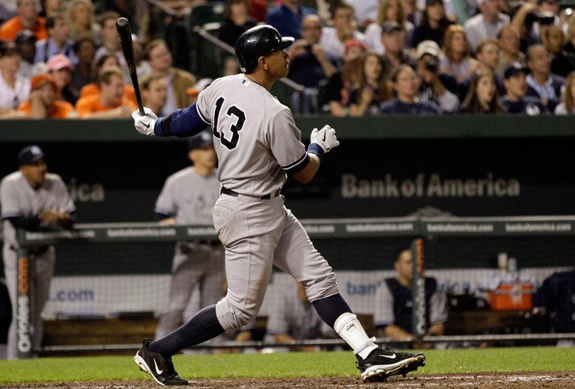 BALTIMORE, MD - APRIL 23: Alex Rodriguez #13 of the New York Yankees follows his grand slam home run against the Baltimore Orioles during the eighth inning at Oriole Park at Camden Yards on April 23, 2011 in Baltimore, Maryland.  (Photo by Rob Carr/Getty Images)