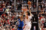 PORTLAND, OR - APRIL 23:  Brandon Roy #7 of the Portland Trail Blazers shoots Shawn Marion #0 of the Dallas Mavericks in Game Four of the Western Conference Quarterfinals in the 2011 NBA Playoffs on April 23, 2011 at the Rose Garden in Portland, Oregon. NOTE TO USER: User expressly acknowledges and agrees that, by downloading and or using this photograph, User is consenting to the terms and conditions of the Getty Images License Agreement.  (Photo by Jonathan Ferrey/Getty Images)
