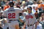 SAN FRANCISCO, CA - APRIL 24:  Martin Prado #14 congratulates Jason Heyward #22 of the Atlanta Braves after they both scored on a double by Chipper Jones #10 of the Atlanta Braves in the first inning of their game against the San Francisco Giants at AT&T Park on April 24, 2011 in San Francisco, California.  (Photo by Ezra Shaw/Getty Images)