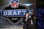 NEW YORK - APRIL 28:  JaMarcus Russell poses with NFL Commissioner Roger Goodell after being chosen first overall by the Oakland Raiders at the 2007 NFL Draft at Radio City Music Hall April 28, 2007 in New York City.  (Photo by Nick Laham/Getty Images)