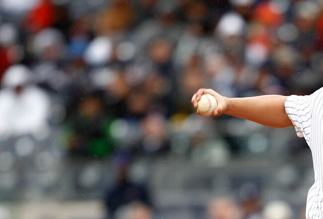 NEW YORK, NY - MARCH 31:  Joba Chamberlain #62 of the New York Yankees pitches against the Detroit Tigers in the seventh inning on Opening Day at Yankee Stadium on March 31, 2011 in the Bronx borough of New York City.  The Yankees won 6-3 in the ninth inning. (Photo by Jeff Zelevansky/Getty Images)