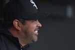 CHICAGO, IL - APRIL 07: Manager Ozzie Guillen #13 of the Chicago White Sox sits in the dugout before the home opener against the Tampa Bay Rays at U.S. Cellular Field on April 7, 2011 in Chicago, Illinois. The White Sox defeated the Rays 5-1. (Photo by Jonathan Daniel/Getty Images)