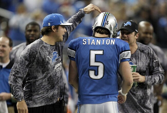 DETROIT, MI - DECEMBER 12:  Drew Stanton #5 of the Detroit Lions is congragulated by Matthew Stafford #9 and Shaun Hill #14 after a fourth quarter touchdown against the Green Bay Packers on December 12, 2010 at Ford Field in Detroit, Michigan. Detroit won the game 7-3. (Photo by Gregory Shamus/Getty Images)