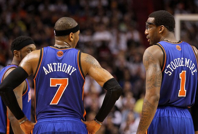 MIAMI, FL - FEBRUARY 27:  Carmelo Anthony #7 and Amar'e Stoudemire #1 of the New York Knicks talk during a game against the the Miami Heat at American Airlines Arena on February 27, 2011 in Miami, Florida. NOTE TO USER: User expressly acknowledges and agrees that, by downloading and/or using this Photograph, User is consenting to the terms and conditions of the Getty Images License Agreement.  (Photo by Mike Ehrmann/Getty Images)