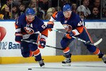 UNIONDALE, NY - MARCH 11: Frans Nielsen #51 and Michael Grabner #40 of the New York Islanders skate against the Boston Bruins at the Nassau Coliseum on March 11, 2011 in Uniondale, New York.  (Photo by Bruce Bennett/Getty Images)
