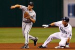 ST. PETERSBURG, FL - APRIL 21:  Infielder Ben Zobrist #18 of the Tampa Bay Rays is forced out at second as infielder Omar Vizquel #11 of the Chicago White Sox throws over to third during the game at Tropicana Field on April 21, 2011 in St. Petersburg, Florida.  (Photo by J. Meric/Getty Images)