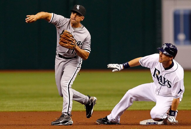 ST. PETERSBURG, FL - APRIL 21:  Infielder Ben Zobrist #18 of the Tampa Bay Rays is forced out at second as infielder Omar Vizquel #11 of the Chicago White Sox throws over to third during the game at Tropicana Field on April 21, 2011 in St. Petersburg, Florida.  (Photo by J. Meric/Getty Images)