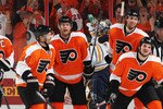 PHILADELPHIA, PA - APRIL 26:  Daniel Carcillo #13 of the Philadelphia Flyers celebrates scoring a third period goal against Jhonas Enroth #1 of the Buffalo Sabres with teammates in Game Seven of the Eastern Conference Quarterfinals during the 2011 NHL Stanley Cup Playoffs at Wells Fargo Center on April 26, 2011 in Philadelphia, Pennsylvania.  (Photo by Bruce Bennett/Getty Images)