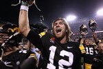 TEMPE, AZ - DECEMBER 28:  Quarterback Ricky Stanzi #12 of the Iowa Hawkeyes celebrates with teammates after defeating the Missouri Tigers in the Insight Bowl at Sun Devil Stadium on December 28, 2010 in Tempe, Arizona. The Hawkeyes defeated the Tigers 27-24.  (Photo by Christian Petersen/Getty Images)