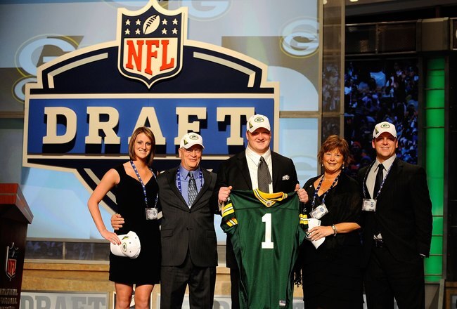 NEW YORK - APRIL 22:  Bryan Bulaga from the Iowa Hawkeyes holds up a Green Bay Packers jersey as he poses with friends and family after the Packers drafted him number 23 overall during the first round of the 2010 NFL Draft at Radio City Music Hall on April 22, 2010 in New York City.  (Photo by Jeff Zelevansky/Getty Images)