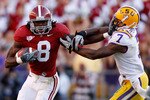 BATON ROUGE, LA - NOVEMBER 06:  Julio Jones #8 of the Alabama Crimson Tide avoids a tackle by Patrick Peterson #7 of the Louisiana State University Tigers at Tiger Stadium on November 6, 2010 in Baton Rouge, Louisiana.  The Tigers defeated the Crimson Tide 24-21.  (Photo by Chris Graythen/Getty Images)