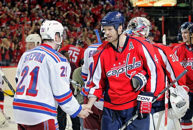 WASHINGTON , DC - APRIL 23:  Jason Arnott #44 of the Washington Capitals greets Derek Stepan #21 of the New York Rangers during the handshake following a 3-1 win over the Rangers in Game Five of the Eastern Conference Quarterfinals during the 2011 NHL Stanley Cup Playoffs at the Verizon Center on April 23, 2011 in Washington, DC. The Capitals clinched the series in five games. (Photo by Len Redkoles/Getty Images)