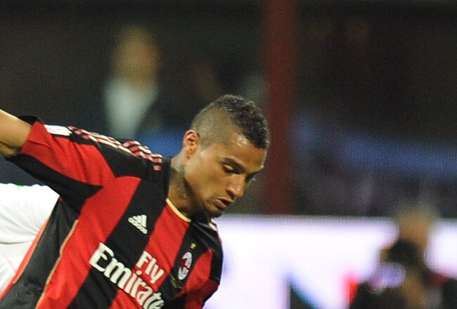 MILAN, ITALY - APRIL 20:  Kevin Prince Boateng (R) of Milan is challenged by Cesare Bovo of Palermo during the TIM Cup semifinal match between AC Milan and US Citta di Palermo at Stadio Giuseppe Meazza on April 20, 2011 in Milan, Italy.  (Photo by Tullio M. Puglia/Getty Images)