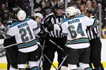 LOS ANGELES, CA - APRIL 25:  The referees break up a scuffle between the San Jose Sharks and the Los Angeles Kings in game six of the Western Conference Quarterfinals during the 2011 NHL Stanley Cup Playoffs at Staples Center on April 25, 2011 in Los Angeles, California.  (Photo by Harry How/Getty Images)