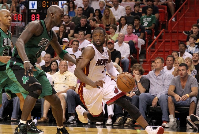MIAMI, FL - APRIL 10:  Dwyane Wade #3 of the Miami Heat drives on Kevin Garnett #5 of the Boston Celtics during a game  at American Airlines Arena on April 10, 2011 in Miami, Florida. NOTE TO USER: User expressly acknowledges and agrees that, by downloading and/or using this Photograph, User is consenting to the terms and conditions of the Getty Images License Agreement.  (Photo by Mike Ehrmann/Getty Images)