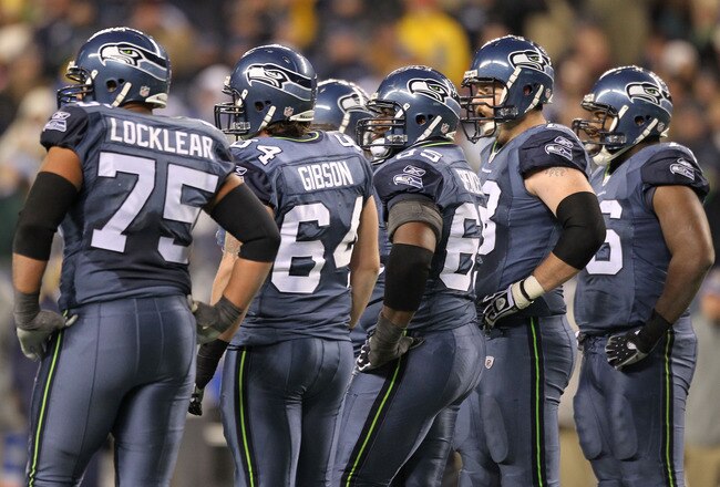 SEATTLE, WA - JANUARY 02:  Members of the Seattle Seahawks offensive line stand on the field during the game against the St. Louis Ramsat Qwest Field on January 2, 2011 in Seattle, Washington.  (Photo by Otto Greule Jr/Getty Images)