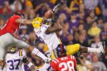 BATON ROUGE, LA - NOVEMBER 20:  Patrick Peterson #7 of the Louisiana State University Tigers nearly intercepts a pass in the final seconds against Markeith Summers #16 and Korvic Neat #28 of the Ole Miss Rebels as time expired at Tiger Stadium on November 20, 2010 in Baton Rouge, Louisiana.  (Photo by Kevin C. Cox/Getty Images)