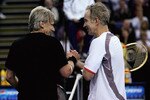 BELFAST, UNITED KINGDOM - FEBRUARY 22:  John McEnroe of the United States congratulates Bjorn Borg of Sweden after he won his match during the second day of the BlackRock Tour of Champions at the Odyssey Arena February 22, 2008 in Belfast, Northern Ireland.  (Photo by Matthew Lewis/Getty Images)