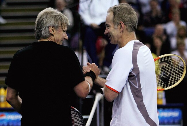 BELFAST, UNITED KINGDOM - FEBRUARY 22:  John McEnroe of the United States congratulates Bjorn Borg of Sweden after he won his match during the second day of the BlackRock Tour of Champions at the Odyssey Arena February 22, 2008 in Belfast, Northern Ireland.  (Photo by Matthew Lewis/Getty Images)