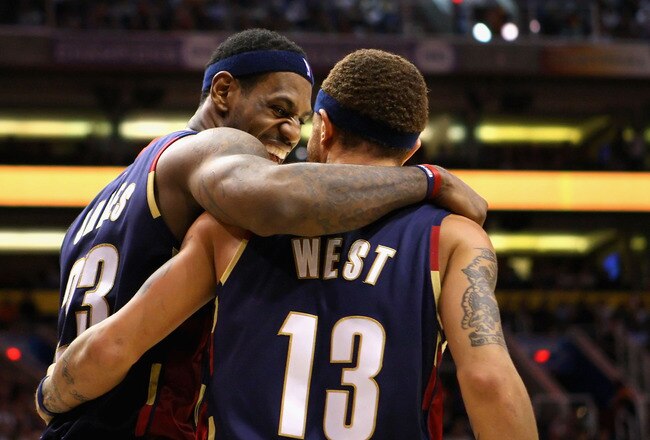 PHOENIX - DECEMBER 21:  LeBron James #23 of the Cleveland Cavaliers celebrates with teammate Delonte West #13 after a three point play against the Phoenix Suns during the NBA game at US Airways Center on December 21, 2009 in Phoenix, Arizona. The Cavaliers defeated the Suns 109-91.  NOTE TO USER: User expressly acknowledges and agrees that, by downloading and or using this photograph, User is consenting to the terms and conditions of the Getty Images License Agreement.  (Photo by Christian Petersen/Getty Images)