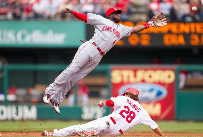 ST. LOUIS, MO - APRIL 23: Colby Rasmus #28 of the St. Louis Cardinals steals second base against Brandon Phillips #4 of the Cincinnati Reds at Busch Stadium on April 23, 2011 in St. Louis, Missouri.  (Photo by Dilip Vishwanat/Getty Images)