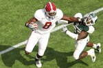 ORLANDO, FL - JANUARY 01: Julio Jones #8 of the Alabama Crimson Tide stiffarms Chris Rucker #29 of  the Michigan State Spartans during the Capitol One Bowl at the Florida Citrus Bowl on January 1, 2011 in Orlando, Florida.  (Photo by Mike Ehrmann/Getty Images)