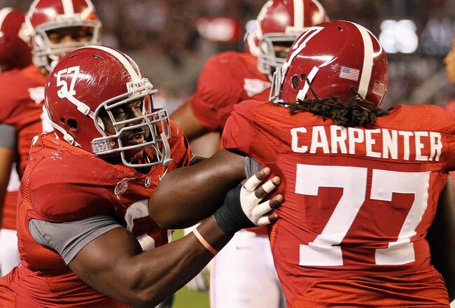 TUSCALOOSA, AL - OCTOBER 16:  Marcell Dareus #57 and James Carpenter #77 of the Alabama Crimson Tide against the Ole Miss Rebels at Bryant-Denny Stadium on October 16, 2010 in Tuscaloosa, Alabama.  (Photo by Kevin C. Cox/Getty Images)
