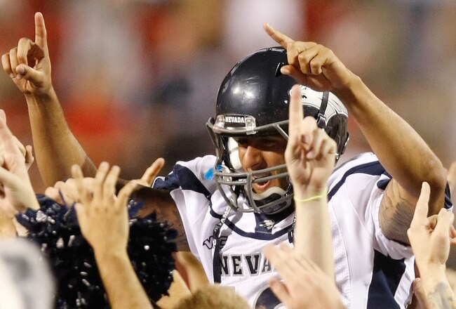 LAS VEGAS - OCTOBER 02:  Quarterback Colin Kaepernick #10 of the Nevada Reno Wolf Pack celebrates with fans after defeating the UNLV Rebels 44-26 at Sam Boyd Stadium October 2, 2010 in Las Vegas, Nevada.  (Photo by Ethan Miller/Getty Images)