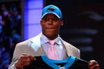 NEW YORK, NY - APRIL 28:  Cam Newton, #1 overall pick by the Carolina Panthers holds up a jersey on stage after he was picked during the 2011 NFL Draft at Radio City Music Hall on April 28, 2011 in New York City.  (Photo by Chris Trotman/Getty Images)