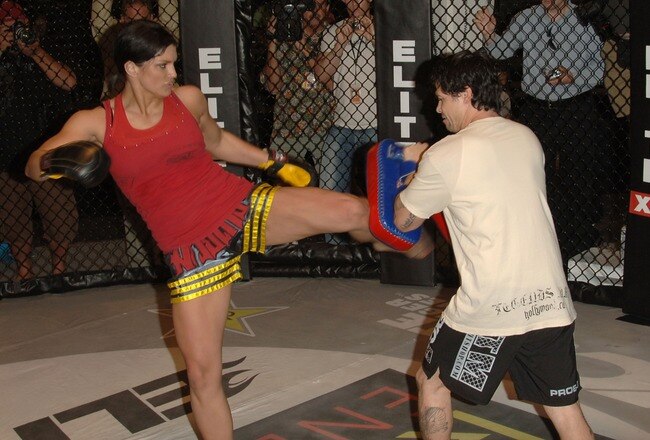 STUDIO CITY, CA - MAY 19:  MMA fighter Gina Carano (L) demonstrates MMA fighter techniques at CBS's 'Elite XC Saturday Night Fights' Press Conference at CBS Radford Studios on May 19, 2008 in Studio City, California.  (Photo by Stephen Shugerman/Getty Images)