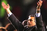 MANCHESTER, ENGLAND - JANUARY 26: Coach Jose Mourhino of Chelsea celebrates victory after the Carling Cup Semi Final Second Leg match between Manchester United and Chelsea at Old Trafford on January 26, 2005 in Manchester, England.  (Photo by Laurence Griffiths/Getty Images)