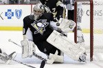 PITTSBURGH, PA - APRIL 27:  Marc-Andre Fleury #29 of the Pittsburgh Penguins makes a glove save during a power play against the Tampa Bay Lightning in Game Seven of the Eastern Conference Quarterfinals during the 2011 NHL Stanley Cup Playoffs at Consol Energy Center on April 27, 2011 in Pittsburgh, Pennsylvania.  (Photo by Justin K. Aller/Getty Images)