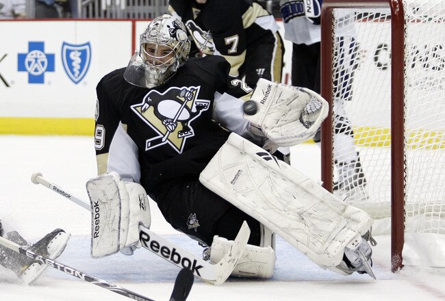 PITTSBURGH, PA - APRIL 27:  Marc-Andre Fleury #29 of the Pittsburgh Penguins makes a glove save during a power play against the Tampa Bay Lightning in Game Seven of the Eastern Conference Quarterfinals during the 2011 NHL Stanley Cup Playoffs at Consol Energy Center on April 27, 2011 in Pittsburgh, Pennsylvania.  (Photo by Justin K. Aller/Getty Images)
