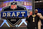 NEW YORK, NY - APRIL 28:  NFL Commissioner Roger Goodell (L) poses for a photo with Cameron Jordan, #24 overall pick by the New Orleans Saints, holds up a jersey on stage during the 2011 NFL Draft at Radio City Music Hall on April 28, 2011 in New York City.  (Photo by Chris Trotman/Getty Images)