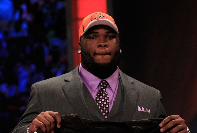 NEW YORK, NY - APRIL 28:  Phil Taylor, #21 overall pick by the Cleveland Browns, holds up a jersey on stage during the 2011 NFL Draft at Radio City Music Hall on April 28, 2011 in New York City.  (Photo by Chris Trotman/Getty Images)