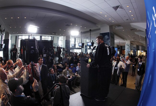 INDIANAPOLIS, IN - FEBRUARY 25: Washington Huskies quarterback Jake Locker answers questions during a media session at the 2011 NFL Scouting Combine at Lucas Oil Stadium on February 25, 2011 in Indianapolis, Indiana. (Photo by Joe Robbins/Getty Images)