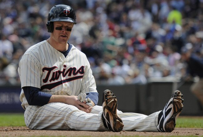 MINNEAPOLIS, MN - APRIL 24: Justin Morneau #33 of the Minnesota Twins reacts after being tagged out at home plate for the final out of the third inning against the Cleveland Indians during their game on April 24, 2011 at Target Field in Minneapolis, Minnesota. Twins defeated the Indians 4-3. (Photo by Hannah Foslien/Getty Images)
