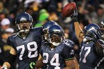 SEATTLE, WA - JANUARY 08:  Running back Marshawn Lynch #24 of the Seattle Seahawks celebrates his 67-yard touchdown run in the fourth quarter against the New Orleans Saints during the 2011 NFC wild-card playoff game at Qwest Field on January 8, 2011 in Seattle, Washington.  (Photo by Jonathan Ferrey/Getty Images)