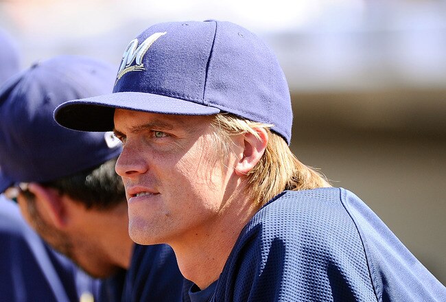 PHOENIX, AZ - MARCH 10:  Pitcher Zack Greinke #13  of the Milwaukee Brewers looks on during the spring training baseball game against Colorado Rockies at Maryvale Baseball Park on March 10, 2011 in Phoenix, Arizona.  (Photo by Kevork Djansezian/Getty Images)
