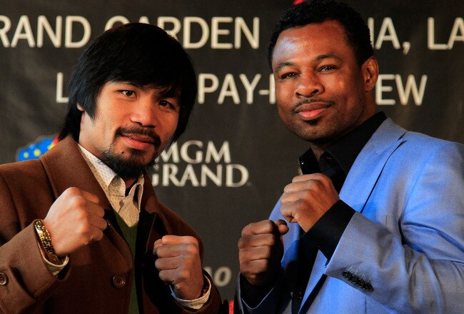 NEW YORK, NY - FEBRUARY 14:  Manny Pacquiao (L) and Shane Mosley pose for photographs to promote their upcoming fight at The Lighthouse at Chelsea Piers on February 14, 2011 in New York City.  (Photo by Chris Trotman/Getty Images)