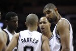 SAN ANTONIO, TX - APRIL 27:  Tim Duncan #21 of the San Antionio Spurs looks on with his teammates against the Memphis Grizzlies in Game Five of the Western Conference Quarterfinals in the 2011 NBA Playoffs on April 27, 2011 at AT&T Center in San Antonio, Texas. NOTE TO USER: User expressly acknowledges and agrees that, by downloading and or using this photograph, User is consenting to the terms and conditions of the Getty Images License Agreement.  (Photo by Jed Jacobsohn/Getty Images)