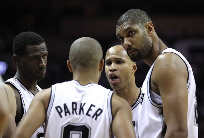 SAN ANTONIO, TX - APRIL 27:  Tim Duncan #21 of the San Antionio Spurs looks on with his teammates against the Memphis Grizzlies in Game Five of the Western Conference Quarterfinals in the 2011 NBA Playoffs on April 27, 2011 at AT&T Center in San Antonio, Texas. NOTE TO USER: User expressly acknowledges and agrees that, by downloading and or using this photograph, User is consenting to the terms and conditions of the Getty Images License Agreement.  (Photo by Jed Jacobsohn/Getty Images)