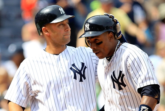 NEW YORK, NY - MAY 01: Curtis Granderson #14 of the New York Yankees is congratulated by his teammate Derek Jeter #2 after his three run homer in the fifth inning against the Toronto Blue Jays at Yankee Stadium on May 1, 2011 in the Bronx borough of New York City. (Photo by Chris Trotman/Getty Images)