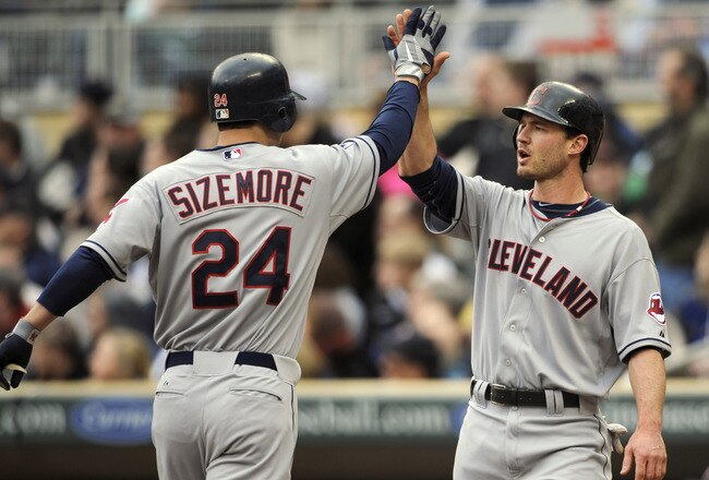 MINNEAPOLIS, MN - APRIL 23: Grady Sizemore #24 and Jack Hannahan #9 of the Cleveland Indians celebrate a two-run home run by Sizemore against the Minnesota Twins during the eighth inning of their game on April 23, 2011 at Target Field in Minneapolis, Minnesota. (Photo by Hannah Foslien/Getty Images)