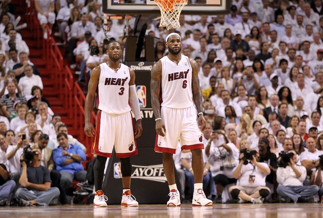 MIAMI, FL - APRIL 27:  Dwyane Wade #3 and LeBron James #6 of the Miami Heat talk during game five of the Eastern Conference Quarterfinals in the 2011 NBA Playoffs against the Philadelphia 76ers at American Airlines Arena on April 27, 2011 in Miami, Florida. NOTE TO USER: User expressly acknowledges and agrees that, by downloading and/or using this Photograph, User is consenting to the terms and conditions of the Getty Images License Agreement.  (Photo by Mike Ehrmann/Getty Images)
