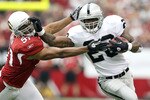 GLENDALE, AZ - SEPTEMBER 26:  Runningback Darren McFadden #20 of the Oakland Raiders rushes the football past Paris Lenon #51 of the Arizona Cardinals during the first quarter of the NFL game at the University of Phoenix Stadium on September 26, 2010 in Glendale, Arizona.  (Photo by Christian Petersen/Getty Images)