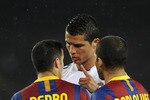 BARCELONA, SPAIN - MAY 03:  Cristiano Ronaldo of Real Madrid (C) argues with Pedro Rodriguez (L) and Dani Alves of FC Barcelona during the UEFA Champions League Semi Final second leg match between Barcelona and Real Madrid at the Camp Nou on May 3, 2011 in Barcelona, Spain.  (Photo by David Ramos/Getty Images)