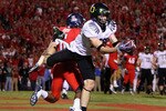 TUCSON, AZ - NOVEMBER 21:  Wide receiver Jeff Maehl #23 of the Oregon Ducks makes a diving touchdown reception in the first overtime past Devin Ross #6 of the Arizona Wildcats during the college football game at Arizona Stadium on November 21, 2009 in Tucson, Arizona. The Ducks defeated the Wildcats 44-41 in second overtime.  (Photo by Christian Petersen/Getty Images)